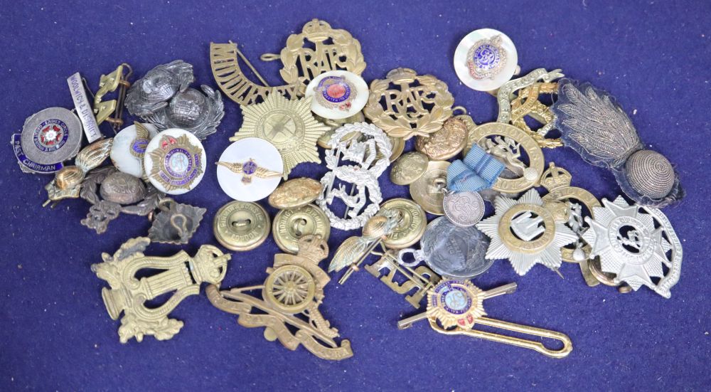 A quantity of military badges, etc.